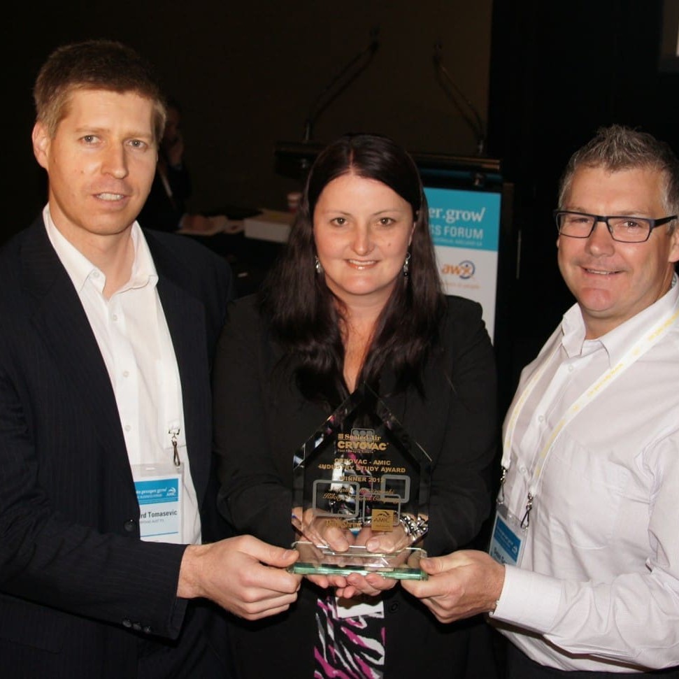 Cryovac's Richard Tomasevic presents the 2012 Industry Study Award to Natasha Masierowski, while Kilcoy chief executive Dean Goode looks on.