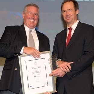 Michael Grogan Managing Director FGM Consultants receives the Training Provider of the Year Award from Richard Bolt from Victoria's Department of Education