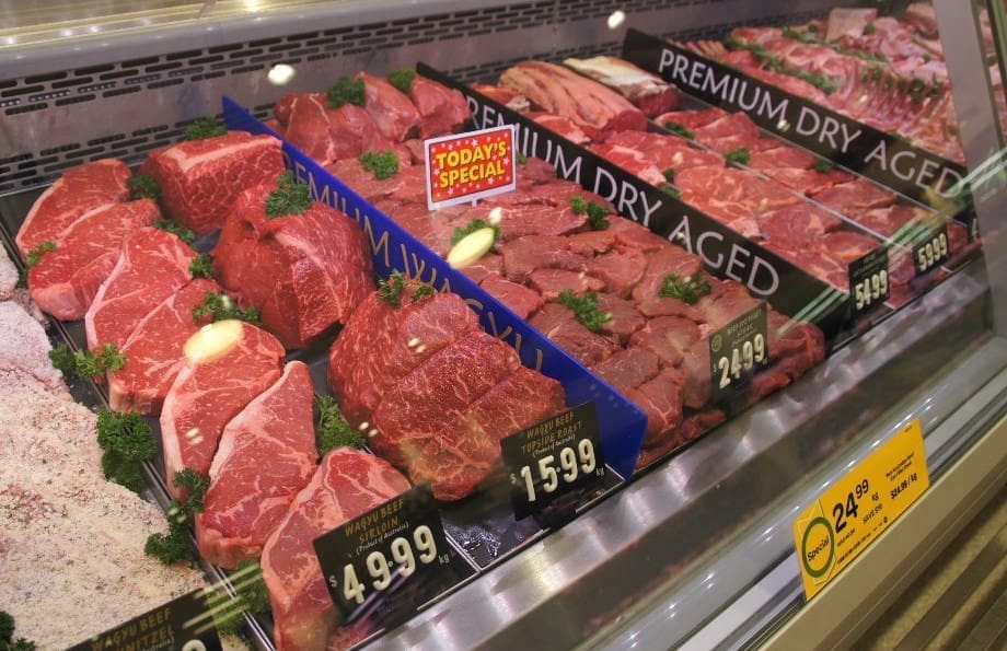 Wagyu and premium dry aged cuts in a supermarket display