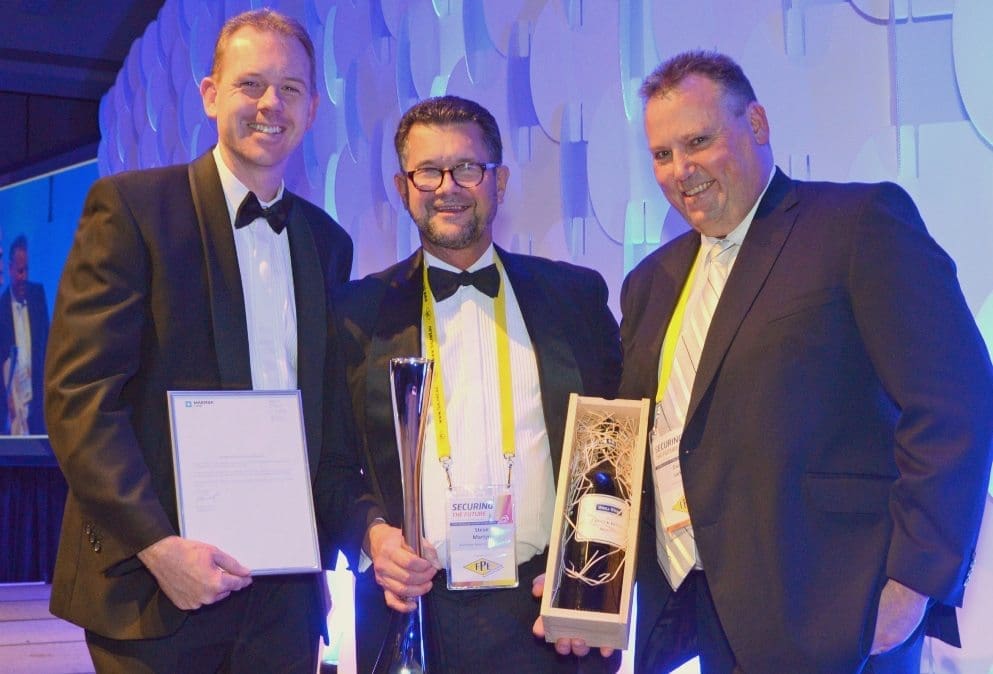 Maersk’s Derek Singline and APC chairman David Larkin congratulate Steve Martyn after he was presented with the Distinguished Australian of the Year award.