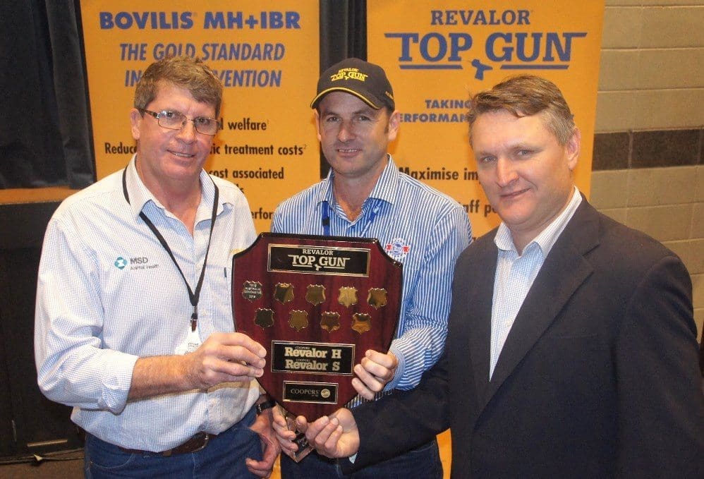 Teys Condamine feedlot manager, Carl Greaves receives the Top Gun perpetual shield from Coopers feedlot manager Brett Kowitz and national account manager Rob Baines.