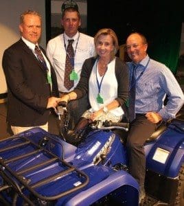 Lamb producers of the year Scott and Kate Bowden, from Bothwell, try out their new quad-bike prize with JBS Southern livestock manager Steve Chapman and their local JBS buyer, Drew Skinner.