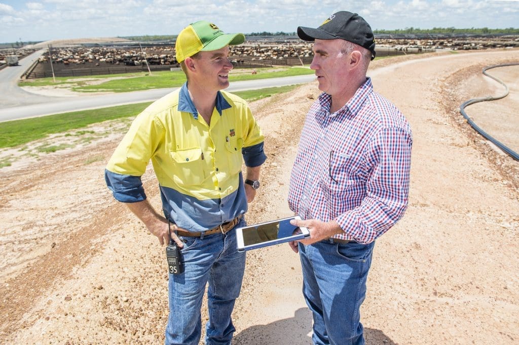 Mort & Co’s Grassdale Feedlot manager Jordan Peach (left) discusses seasonal outlooks with USQ climate scientist Dave McRae.