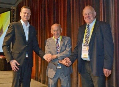 Foodbank CEO Jason Hincks, left, with TFI's Brian James and Fletcher International's Roger Fletcher after the supply agreement was sealed.