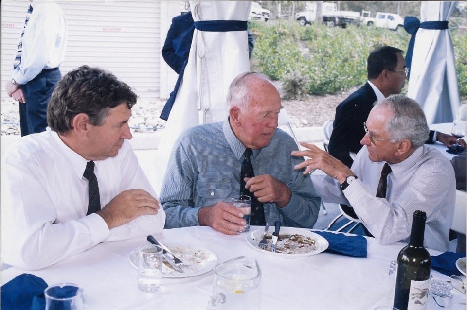 The late Grahame Flynn, right, pictured during a JBS function with former livestock general manager Ross Keane, and cattle producer Stan Henwood